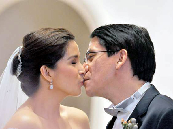 ROSA CITY A brief kiss but one filled with longing sealed their wedding vows