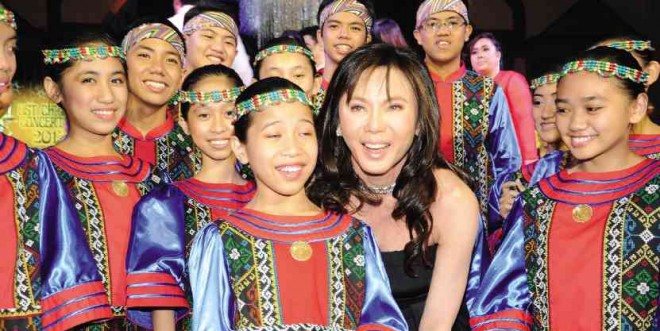 Dr. Vicki Belo with children’s choir