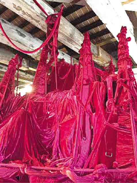 A DETAIL of the huge, velvet-clad sculpture “Shoal” created by José “Boogie” Tence Ruiz now making waves in the 56th Venice Art Biennale. The piece evokes the BRP Sierra Madre that the military intentionally marooned on Ayungin Shoal in theWest Philippine Sea. Ruiz wrapped the “ship” in burgundy velvet similar to that worn by the Señor Nazareno inQuiapo to allude to the religiosity of Filipinos. But “Shoal” also connotes the chaos of the country’s politics. PHOTOS BY CATHY CAÑARES YAMSUAN