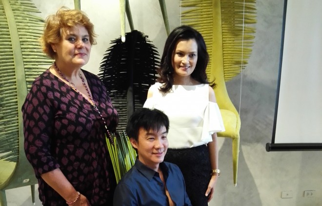 UNICEF Philippines country representative Lotta Sylwander, Unicef Special Advocate for Children Daphne Oseña-Paez, and designer Kenneth Cobonpue seated in his iconic chair.