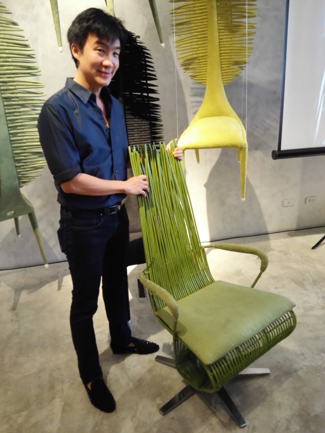 Kenneth Cobonpue poses beside his Yoda chair made for Apec 2015.