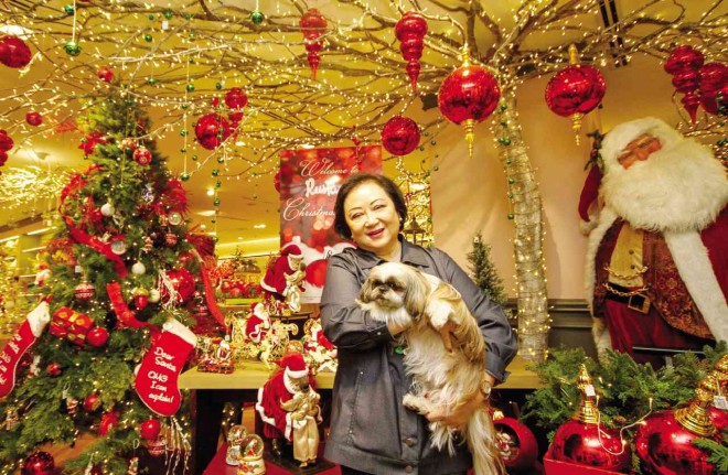 NEDY Tantoco, with Sabrina, in a happy Christmas corner at Rustan’s