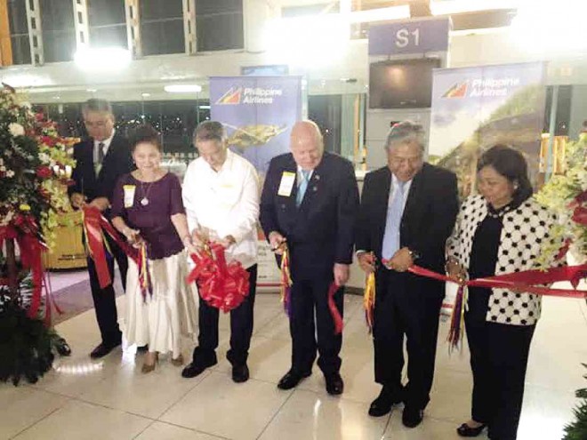 PHILIPPINE Air Lines (PAL) chair Lucio Tan, with wife Carmen,Naia Terminal Manager Enrico Gonzales, PAL president Jaime Bautista and Department of Tourism Director for Market Development Ma. Corazon Jorda-Apo cut the ribbon formally inaugurating PAL’s four times-a-week flights to Cairns and Auckland. PHOTOS BY ALEX Y. VERGARA
