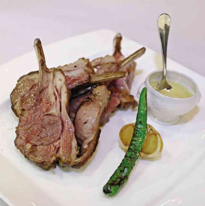 SLOW-COOKED premium lamb rack; Sizzling scallops in black garlic butter lemon (below) PHOTOS BY KIMBERLY DELA CRUZ