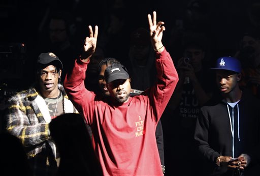 Kanye West gestures to the audience at the unveiling of the Yeezy collection and album release for his latest album, "The Life of Pablo," Thursday, Feb. 11, 2016 at Madison Square Garden in New York. AP PHOTO