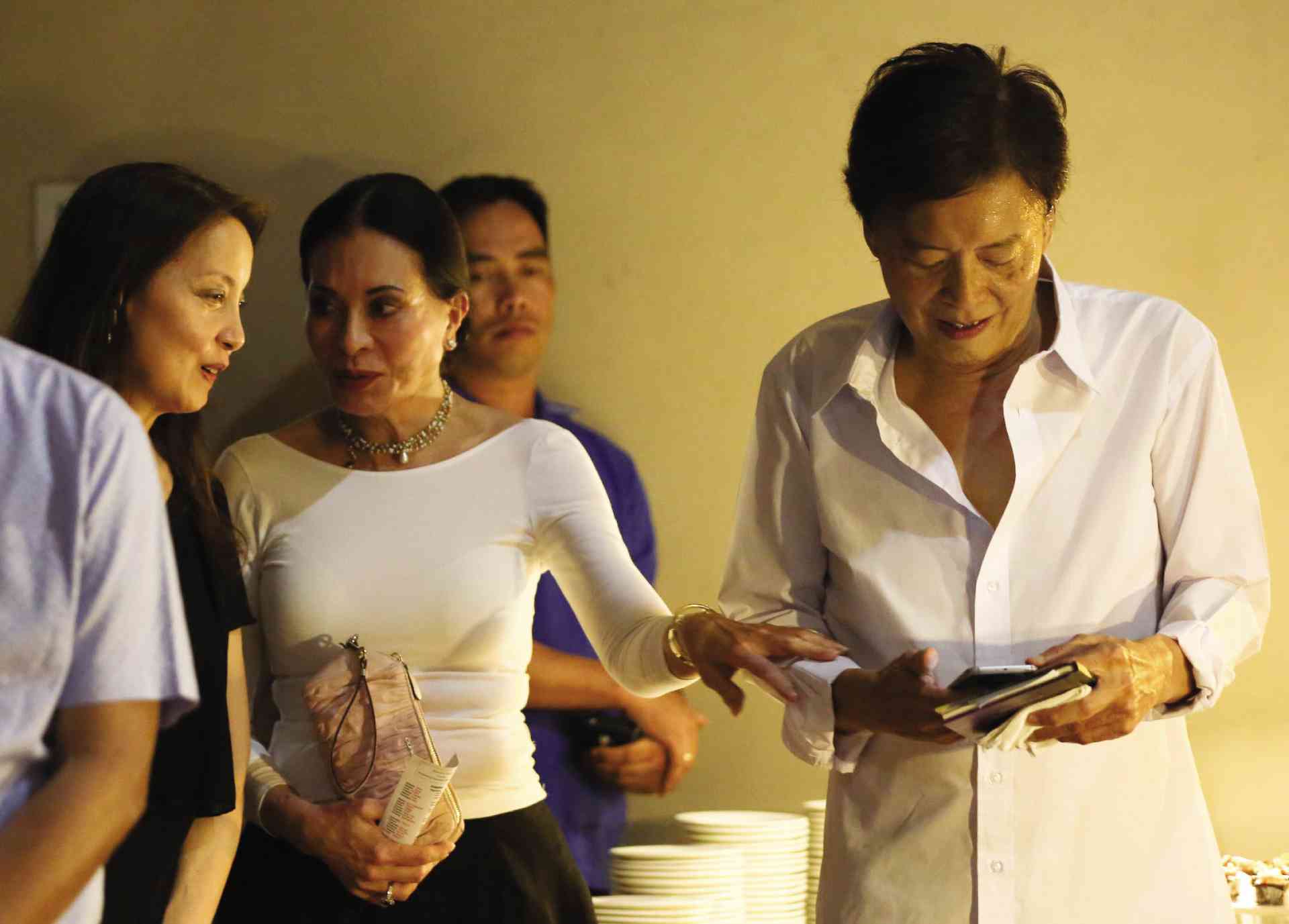 Family friend Tingting Cojuangco (in white blouse) condoles with Ilusorio siblings Ramon and Shereen at the memorial service (above).