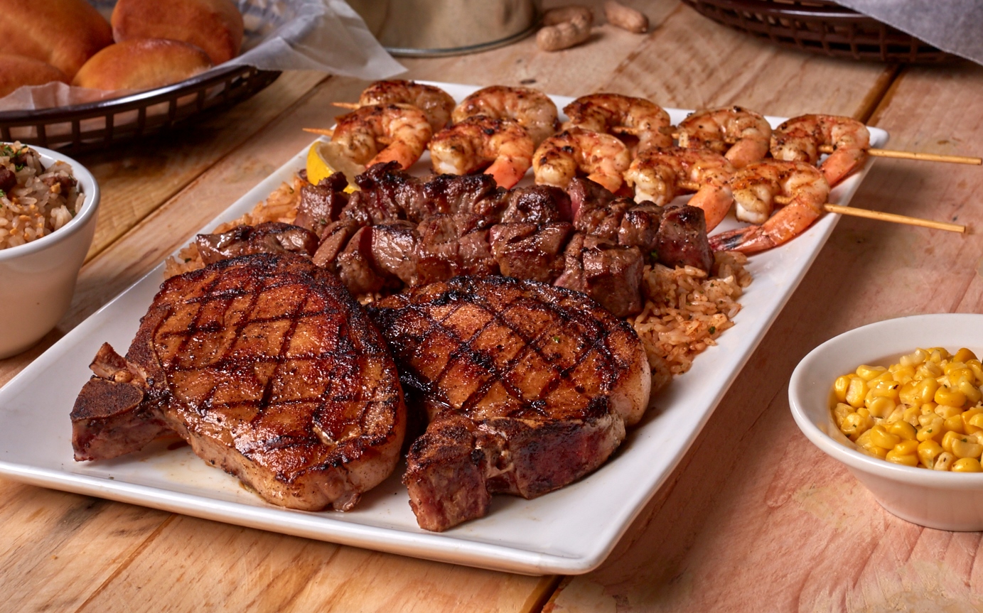 Indulge in this platter filled with pork chops, steak tips and shrimp. 