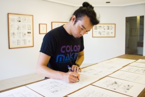 MANIX Abrera and his original pages in the UP Vargas Museum exhibition ORANGE OMEGAN