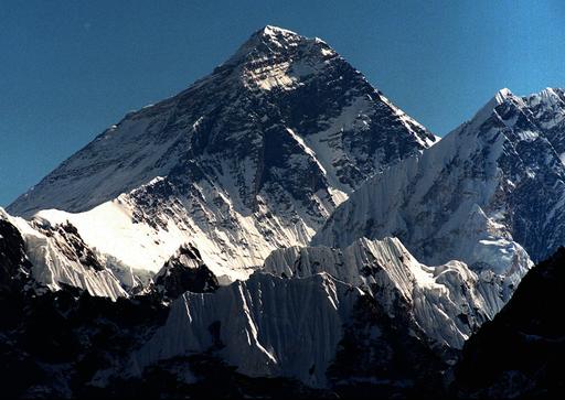 In this October 1996 file photo, Mount Everest is seen from peak Gokyo Ri in Nepal. Chinese state-run mobile news site The Paper reported Wednesday, May 11, 2016, that workers had removed the signatures, dates, doodles and messages left by scores of visitors on two granite tablets on the Chinese side of Mount Everest's northern base camp and plan to name and shame future defilers. AP 