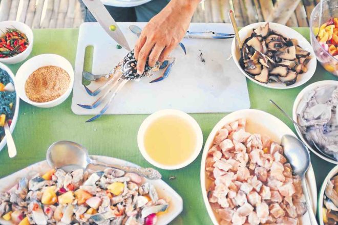 BACK to basics. Mark Lobaton shows Fores how to turn various seafood into “kinilaw.”