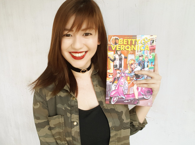 RIAN holding the “Betty and Veronica” comics