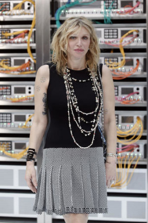 Courtney Love poses for photographers prior to the Chanel's Spring-Summer 2017 ready-to-wear fashion collection presented Tuesday, Oct.4, 2016 in Paris. (AP Photo/Thibault Camus)