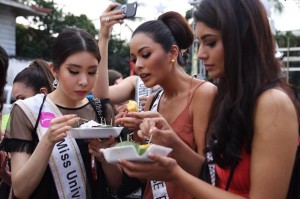 In this Dec. 12, 2016 file photo, Miss Universe candidates from Korea, Philippines and Malaysia are seen sampling the food in Manila during a tour of the Intramuros on Dec. 12, 2016. (Photo courtesy of the Department of Tourism)