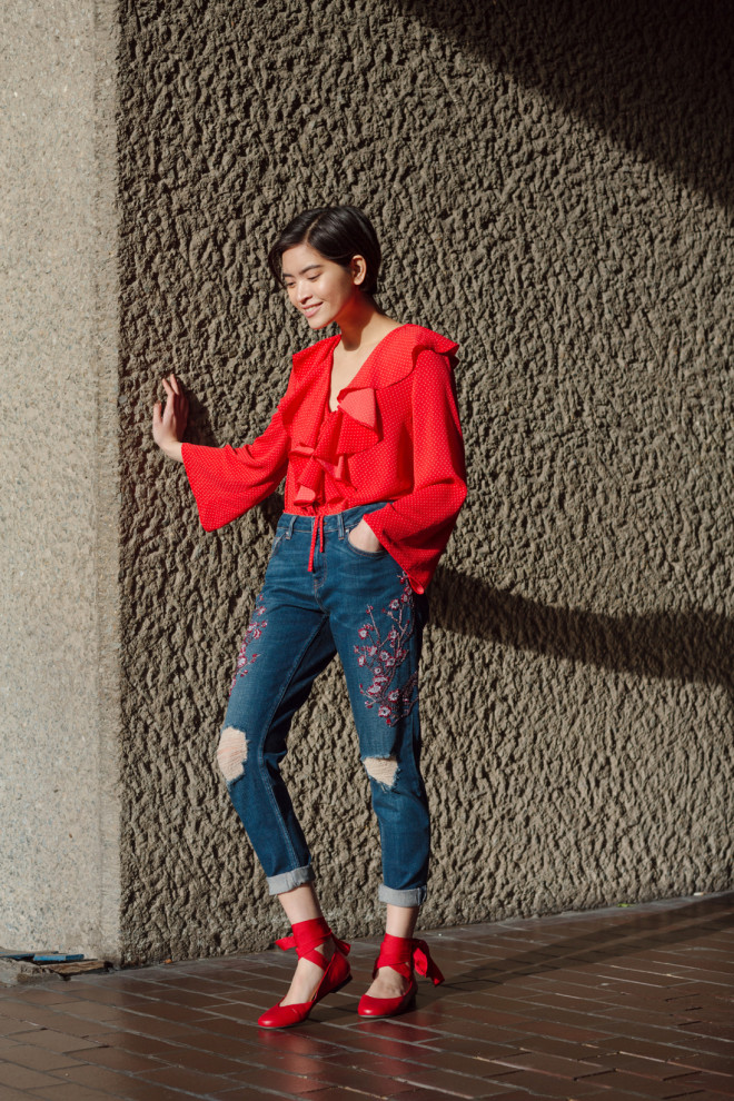 Embroidered jeans, red top and laced-up ballet flats  