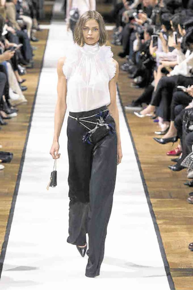Chain belt on a classic black and white number by Bouchra Jarrar