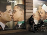 TOPSHOTS. Picture taken on Nov. 16, 2011 in Paris, shows one of many Benetton clothing store windows covered by posters as part of the launch of a provocative publicity campaign entitled "UNHATE". The same campaign appears on newspapers, magazines and on Internet websites. AFP