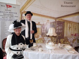 This handout photo released by the Titanic Memorial Cruises shows Carmel Bradburn and Andreas Storic from Adelaide, Australia dressed in period Edwardian costumes posing in a replica of the Titanic dining room, on April 8, 2012 in Southampton. AFP PHOTO /TITANIC MEMORIAL CRUISES/SIMON BROOKE-WEBB/SBW-PHOTO/