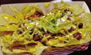 CLASSIC Nachos with chili con carne, cheese sauce, jalapeño and sour cream