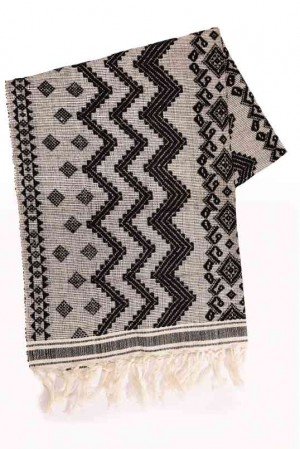 SOFA throw with geometric patterns, available at Kultura