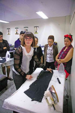 VICTORIA Townsend conducts a pilot class in British bespoke tailoring at Slims Art and Fashion School in Makati.