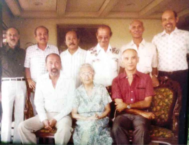 LOLA and her eight boys. Standing from left: Alfredo, Jose, Jesus, Joaquin, Francisco,Marcos. Seated from left: Luis, Lola Enchay, Alejandro