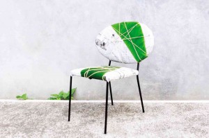 ELLIPTICAL-BACKED chair with banana leaf and newspaper