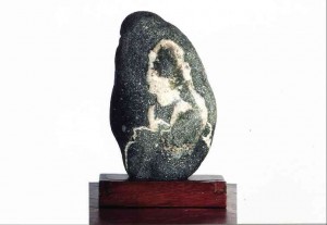 LOCAL stone with woman eating a banana, owned by Letty P. Ligon
