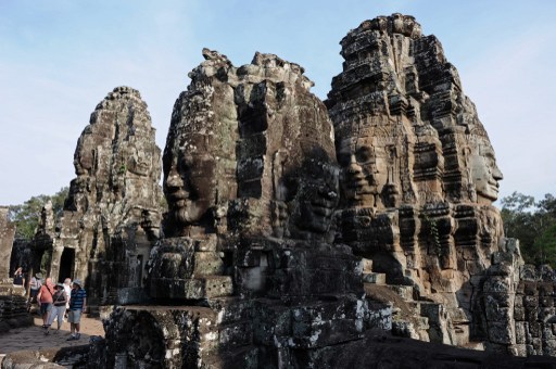 This picture taken on April 2, 2014 shows tourists visiting the Bayon temple, part of the Angkor architectural complex in north-western Cambodia. AFP FILE PHOTO