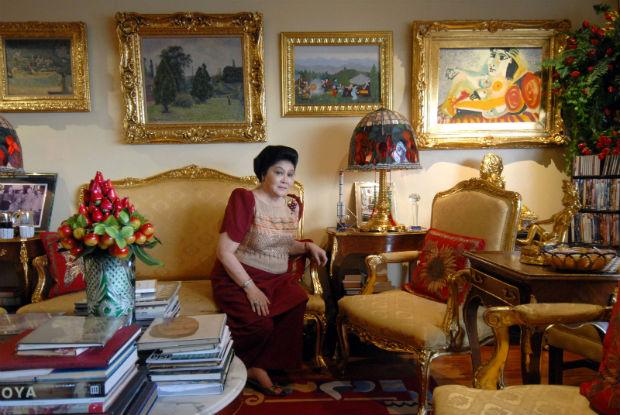 This file photo taken on June 7, 2007 shows former first lady Imelda Marcos is seen in her apartment in Manila with a gallery of paintings including a Picasso, seen at upper right. Philippine authorities moved on September 30, 2014 to seize paintings by Picasso, Gauguin, Miro, Michelangelo and other masters held by Imelda Marcos after getting a court order against the former first lady. AFP/ROMEO GACAD