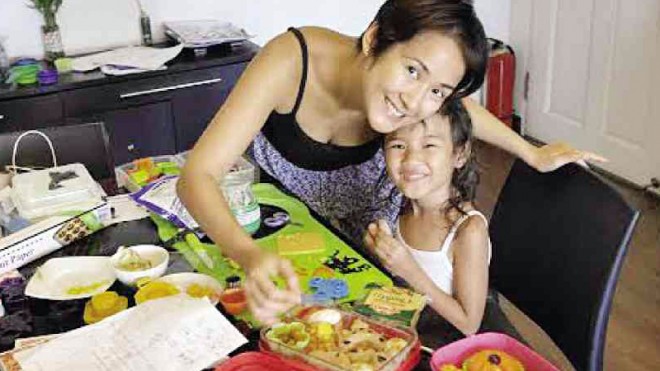 KAT and daughter Zen working on a bento