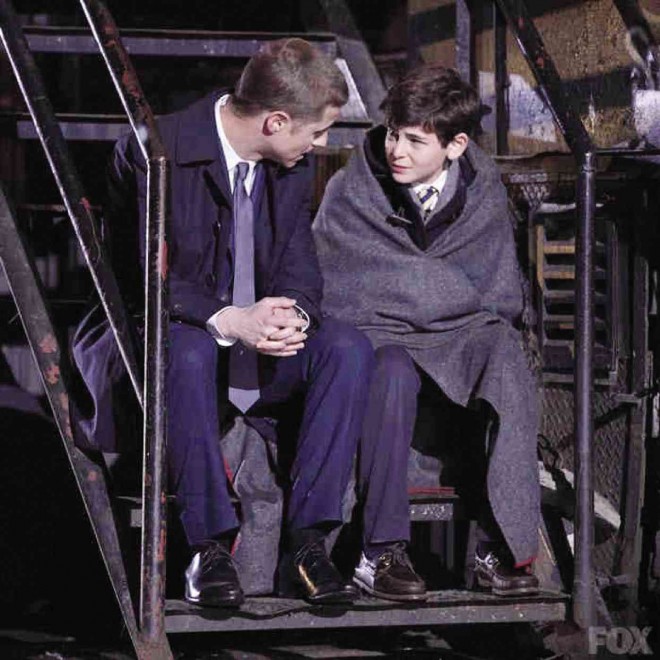 BEN McKenzie (left) as Det. Jim Gordon consoles a young Bruce Wayne.