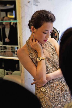 SHUQi wearing the flagship diamond-set Lucea in 18-k pink gold with guilloché black dial.