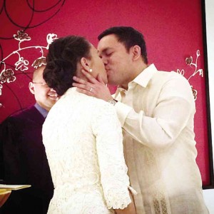 LAS PIÑAS Rep. Mark Villar kisses Diwa party list Rep. Emmeline Aglipay at the end of their civil wedding at Hotel InterContinental in Makati. Aglipay is wearing a two-piece wedding suit made of silk gazar and guipure lace by JC Buendia