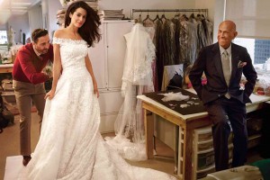 VOGUE captures what would beOscar de la Renta’s last public moment—Amal Alamuddin fitting the gown she would wear to her wedding to George Clooney, designed by a beaming De la Renta.