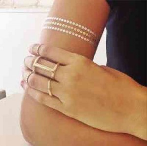 THE BEST way to wear the trend –mixing a faux cuff with a stack of real rings