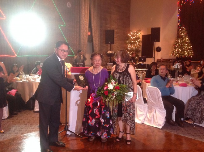 Estela Bischof receives her special award and bouquet at the Ms. Paraluman of 2014 pageant from Noel Cruz and Daisy Bernabe. PHOTO BY MARISA ROQUE