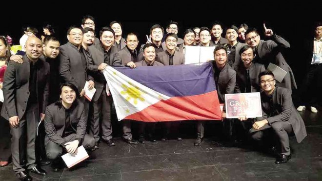 TRIUMPHANT Aleron Choir waving Philippine flag after being declared grand winner in the 10th Busan choral competition.