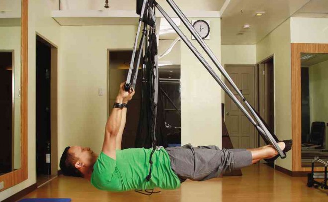 OLE EUGENIO in a pull-up exercise for body alignment PHOTOS BY NELSON MATAWARAN