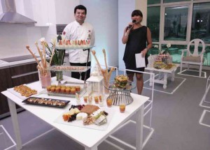 Chef Gino Gonzalez rearranges the unit to become a showroom for his culinary masterpieces.