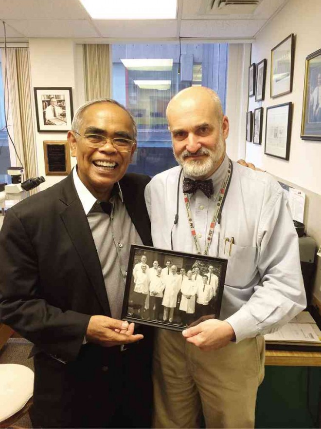 THE AUTHOR reconnects with Prof. Matthew Frosch, and holds a group photo of his former Harvard professors—Dr. Raymond Adams, Fisher andDr. EP Richardson.
