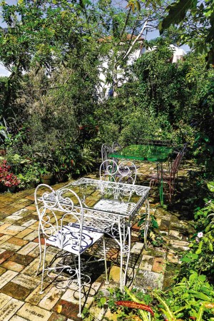 LUSH foliage surrounds the place to make dining al fresco inviting.
