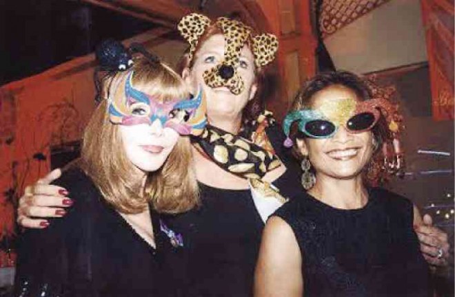 PRIZE-WINNING masks wereworn by Marguerite Lhuillier, Danielle Smal and Bethilda Smith.