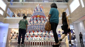 People pass by the Doraemon Tree at One Raffles Place on Dec 22, 2014. -- ST PHOTO: MARK CHEONG