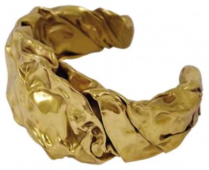 FOR THE “Nion” cuff, the brass was hand beaten to create a crumpled effect.