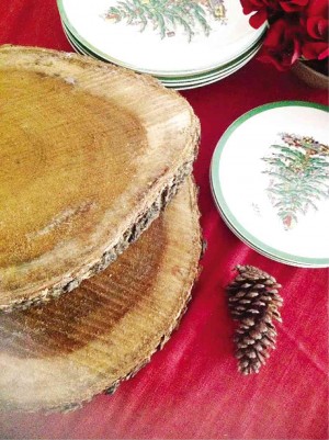 OLD TREE trunks are sawed into one-inch thick pieces to become backdrops to plates