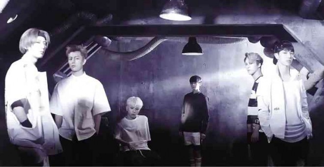 BEAST strikes amean pose in the opening of the music video for “Good Luck.”