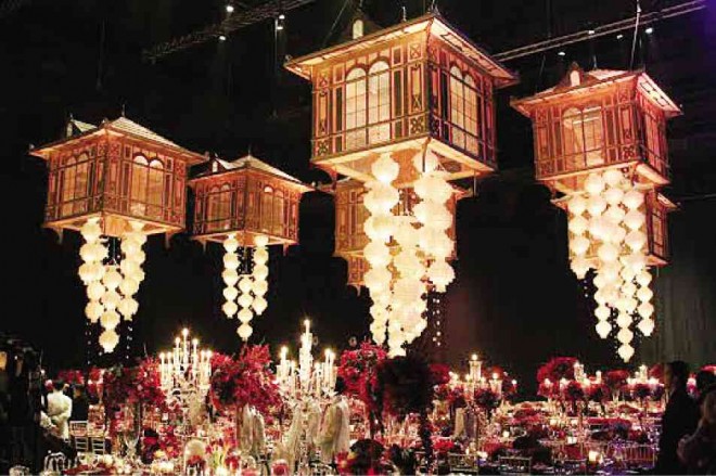 ILLUMINATED representations of the bahay-na-bato hang from the rafters and light up the main dining area.
