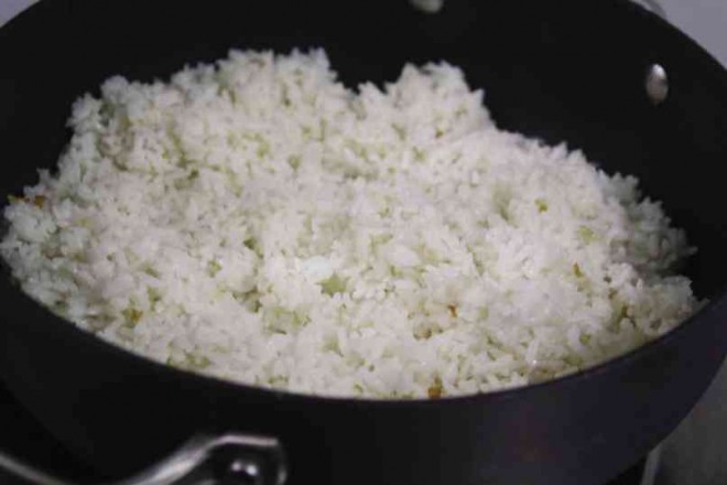 MEANWHILE, fry leftover cooked rice with lots of garlic. Let the beef simmer until the sauce thickens. Transfer in a nice platter and top with spring onions before serving. Serve hot paired with garlic rice.