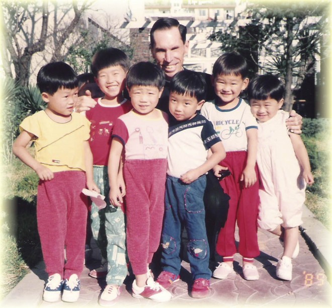 Father Al Schwartz with children in Korea in 1989. CONTRIBUTED PHOTO/SISTERS OF MARY