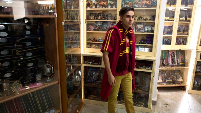 A Harry Potter fan visits an exhibition of the Guinness World Record holding collection of Harry Potter memorabilia, at the Mexican Museum of Antique Toys, in Mexico City, Friday, Feb. 27, 2015. Mexico's fan Menahem Asher Silva Vargas assembled the collection, which contains thousand objects, including figurines, wands, magazines, puzzles, and accessories. (AP Photo/Rebecca Blackwell)